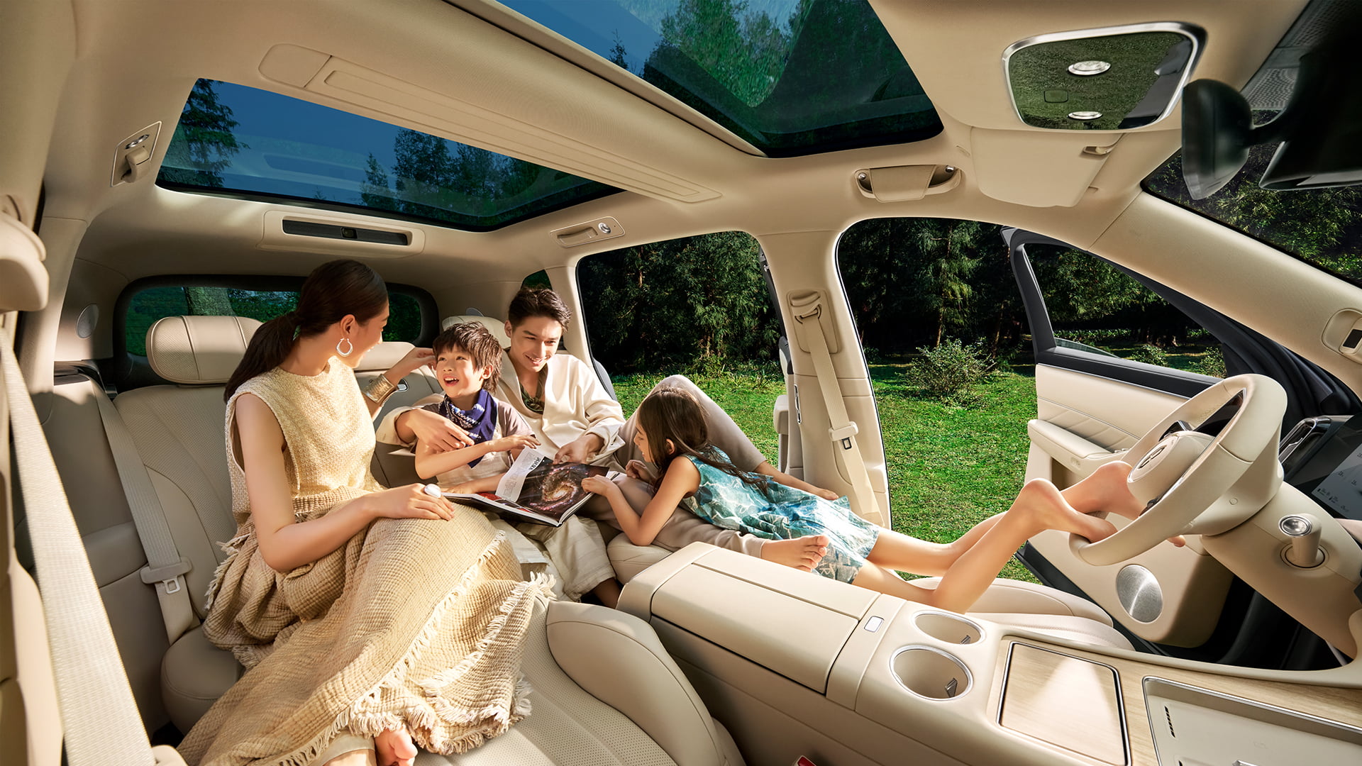 A family chatting happily inside the car, highlighting the spacious three-row cabin