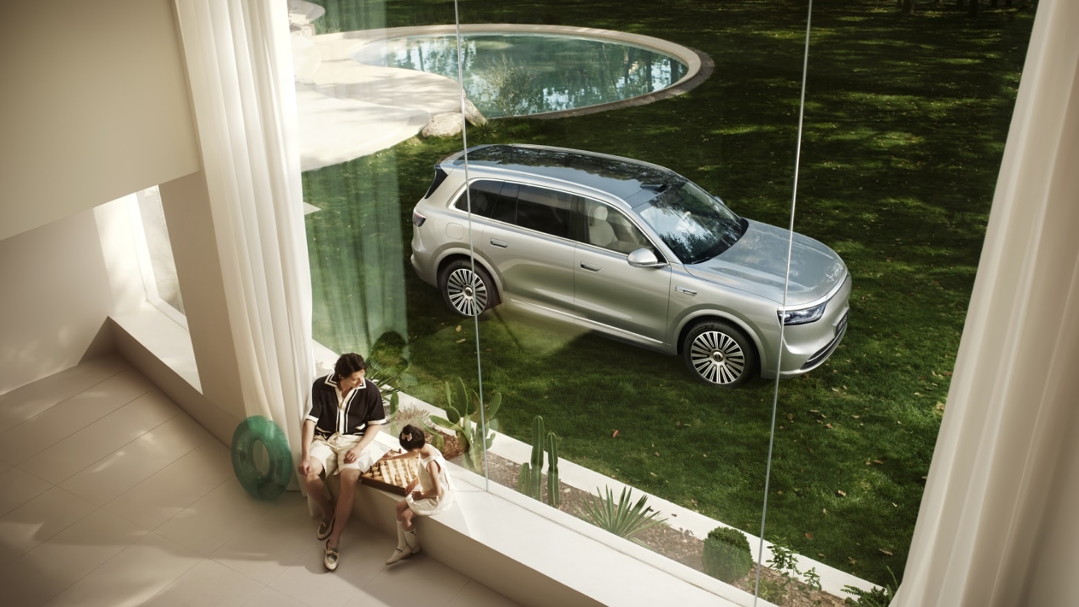 An AITO M8 in Galaxy Silver parked by an urban road, a woman just alighted