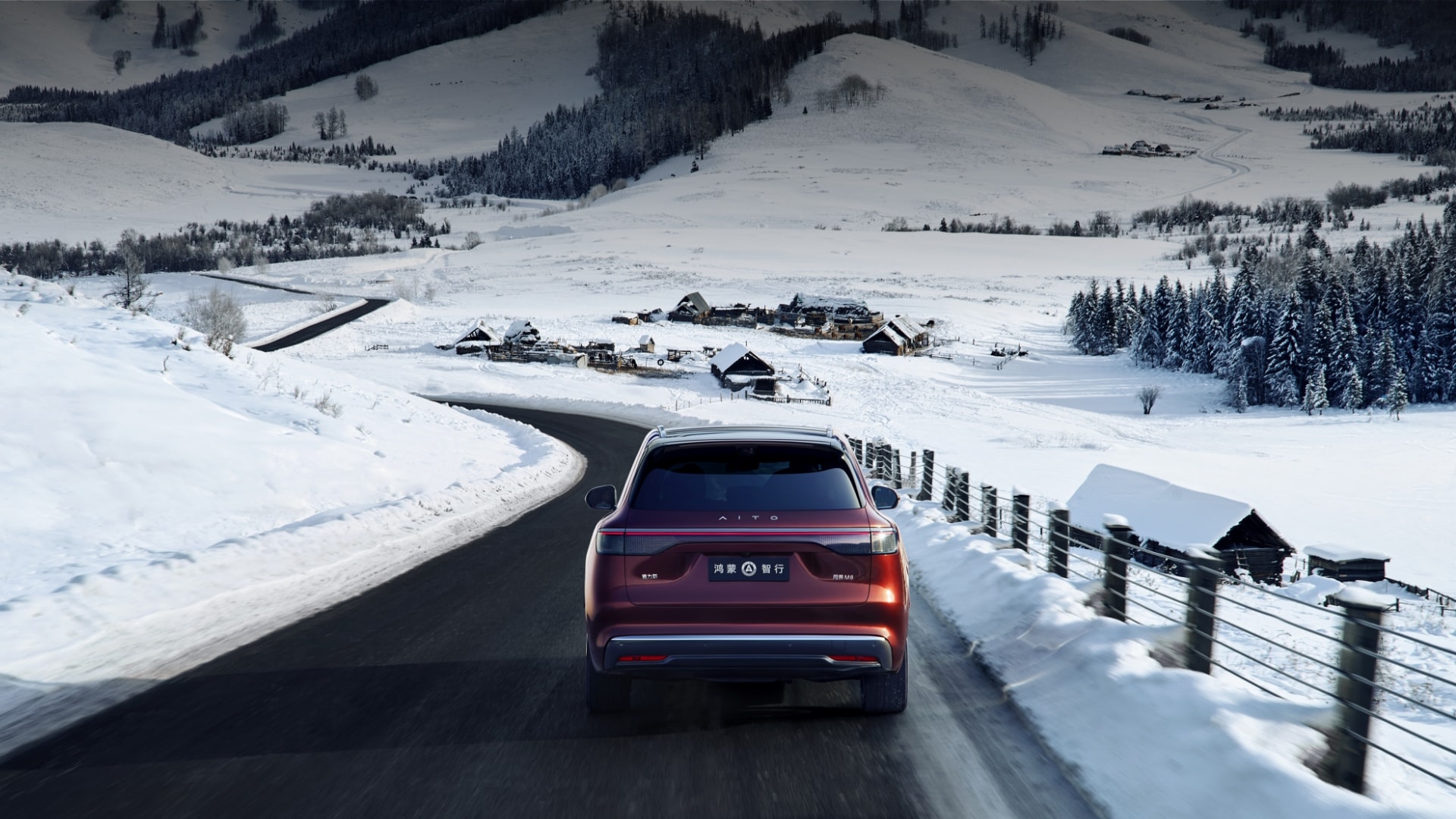 An AITO M8 in Sunset Glow drives on an urban road
