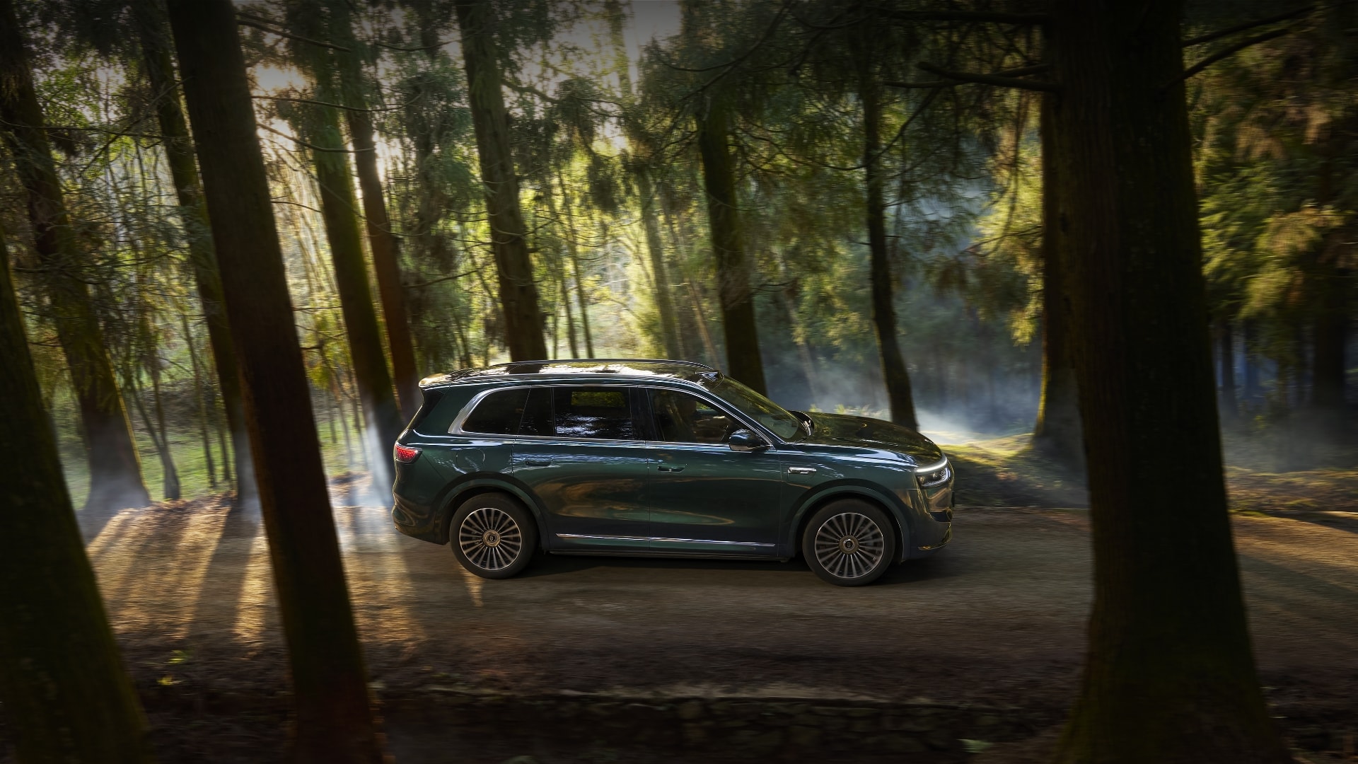 An AITO M8 traverses a rugged mountain road