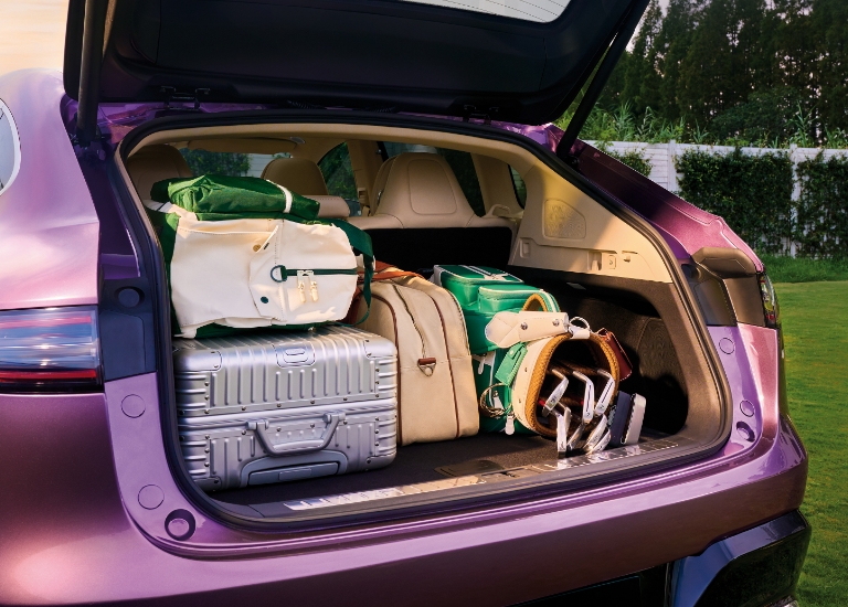 Trunk loaded with luggage, showcasing the Luxeed R7's three-tier trunk space